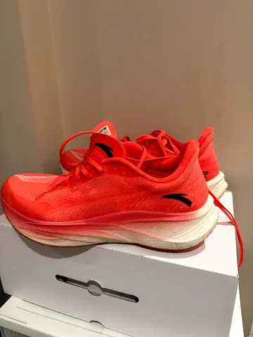 Lightly used mens running shoes - coral color, size available