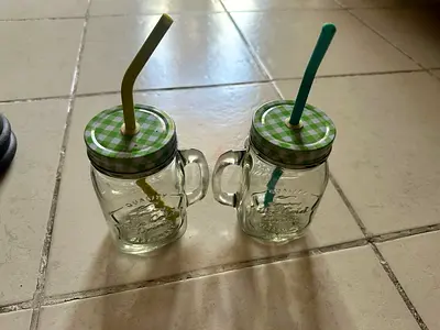 MASON JAR MUGS SET -- 2 glass cups with 2 straws, 2 canning lids.