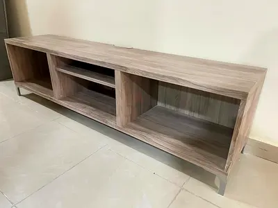 Light wood TV/entertainment unit with open shelving
