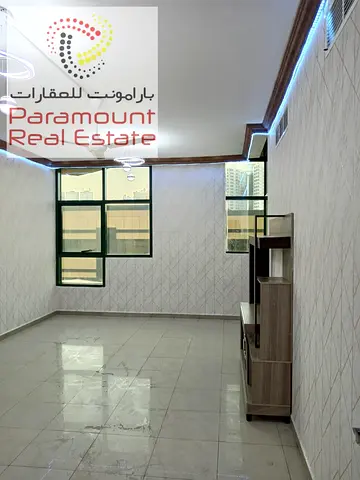 شقة غرفتين وصالة للإيجار في برج الراشدية، عجمان، بإطلالة مفتوحة وحالة جيدة.