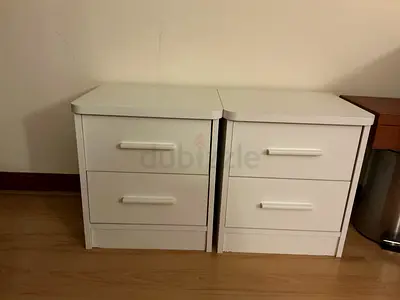 Pair of white bedside cabinets with two drawers each