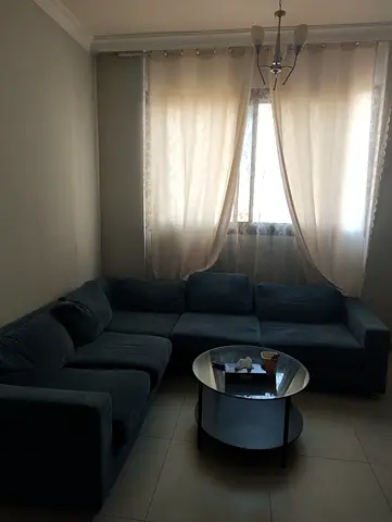 L-shaped velvet sectional sofa with table and curtain , good condition all 1250