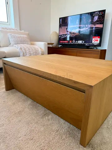 Crate and Barrel oak wood wood coffee table with 2 drawers.
