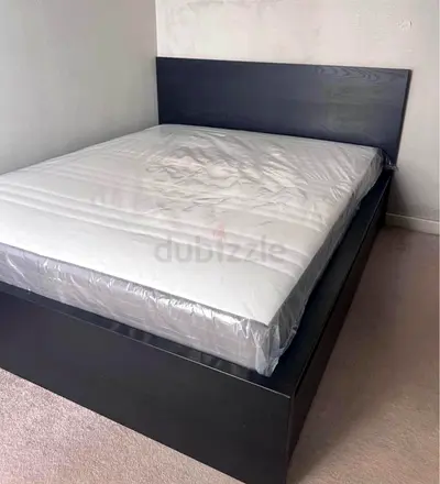 Queen bed frame with mattress - dark wood, good condition