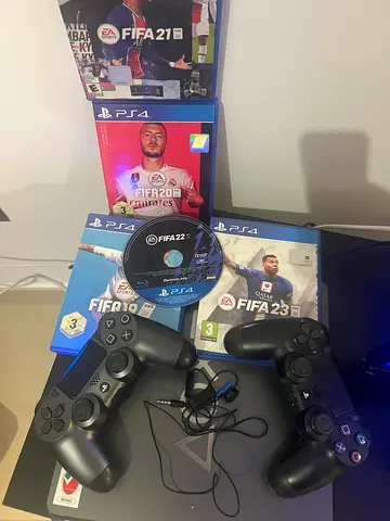 PS 4 Slim PlayStation 4 Slim 1 TB with 2 dual shock controllers and FIFA game collection