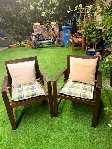 Pair of solid wood outdoor armchairs with cushions - good condition