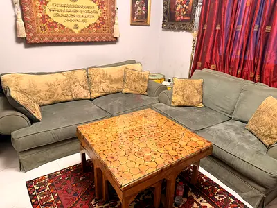 Used L-shaped fabric sofa set with wooden coffee table
