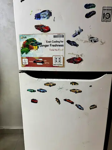 Used White Top-Freezer Refrigerator (With Kids Stickers)
