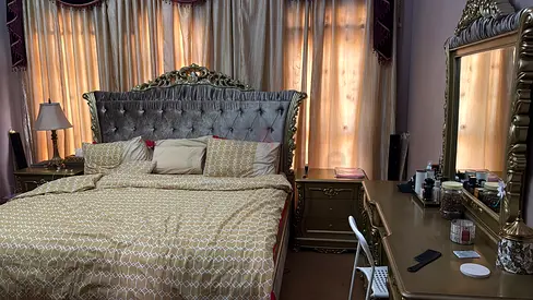 Ornate King-Size Bed with Matching Nightstands and Dresser