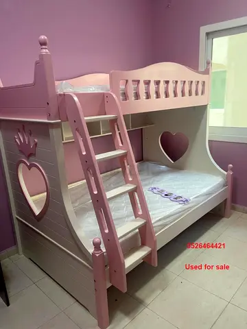 Solid Wooden Pink Bunk Bed with Heart Cutouts — Good Condition and a Cupboard - Good Condition