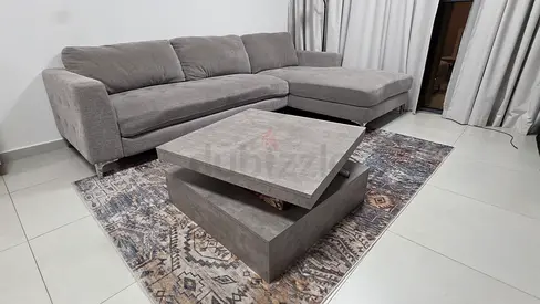 8 months old, Grey L-shaped Fabric Sofa under warranty with  Modern Coffee Table