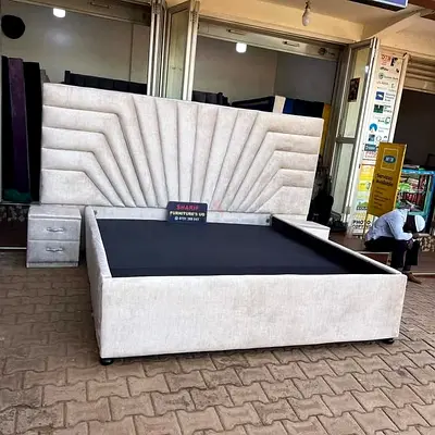 Large upholstered king-size bed frame with tall padded headboard and side drawers - cream