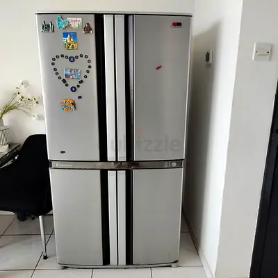Large 4-Door Stainless Steel Refrigerator - Good Working Condition