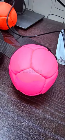 Leather handmade with a soft plush play balls — pink and orange, lightly used