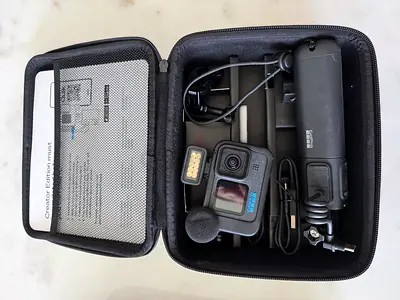 GoPro HERO action camera with microphone, light and handheld grip