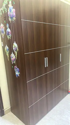 Dark wood 3-door wardrobe with floral decals, good condition