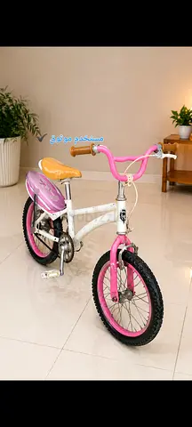 Girls pink  white 16-inch kids bicycle — good condition