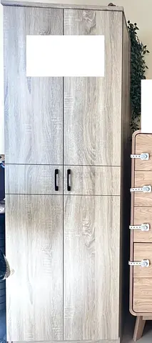 Tall wooden wardrobe / storage cabinet in light oak finish - good condition