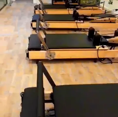 Pilates reformer machines with jump board and box