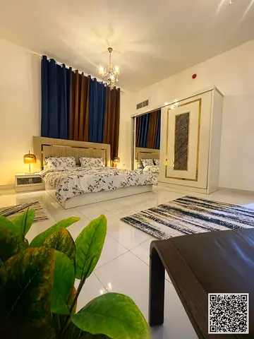 Luxury one-bedroom apartment with a living room and balcony offering an open view. Ajman, Al Nuaimiya. Fully furnished