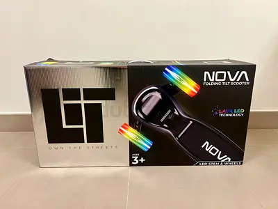 Brand New - NOVA Folding Tilt Scooter with LED Wheels