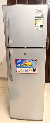 Silver double-door refrigerator - good working condition