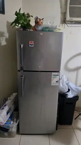 Silver double-door refrigerator in good working condition