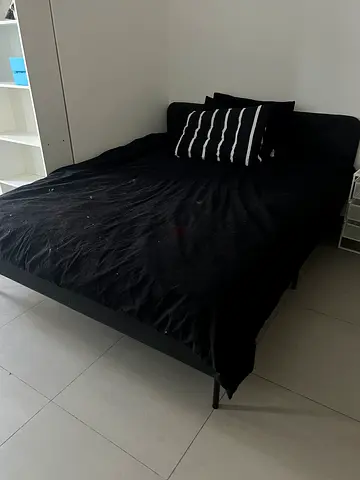 Queen bed frame with mattress and black bedding (used)