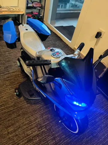 Urgent sale: Kids Electric Ride-On Motorcycle with LED Lights - Blue