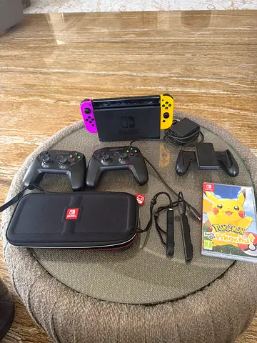 Nintendo Switch Bundle – Pokémon Let’s Go Pikachu + 2 Controllers + Accessories