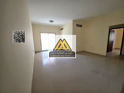 Two-bedroom apartment with hall in Al Nuaimiya 2, large space, balcony, 2 bathrooms, central AC. 32,000 yearly, 4 payments, prime location, close to s