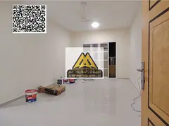 A 1-bedroom apartment with a living room for annual rent in Al Rawda 2 – Ajman, featuring a spacio