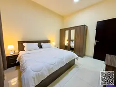Luxurious two-bedroom apartment with a living room, fully furnished, and featuring a balcony with an