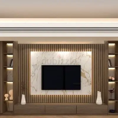Modern built-in entertainment center with marble back panel
