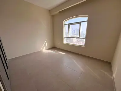 Apartment for rent in Ajman Corniche, two bedrooms and a living room, first occupancy, two master b