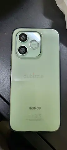 Honor smartphone in good condition — green back, dual cameras