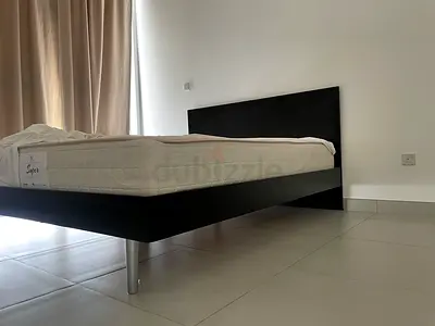 Black wooden bed