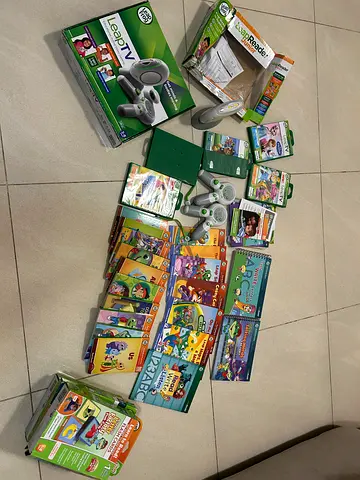 LeapFrog LeapTV system with multiple game cartridges and controllers - bundle