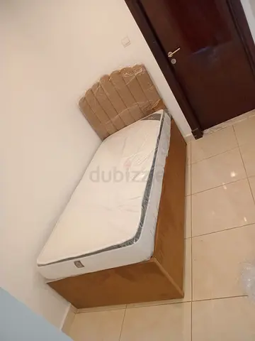 Single wooden bed with new mattress