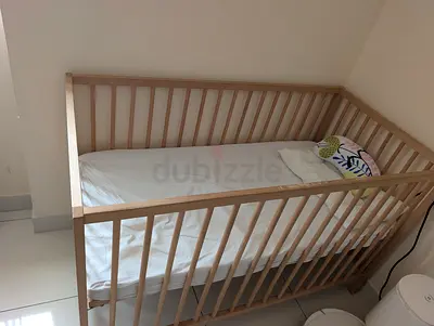 Light wooden baby crib / cot in good condition