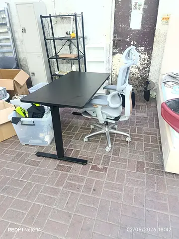 Adjustable Black Office Desk with Ergonomic White Task Chair - Used