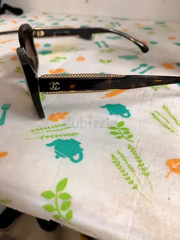 Chanel tortoiseshell sunglasses with rhinestone detail — used once