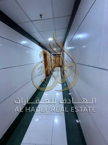 For annual rent, a one-bedroom apartment in Al Taawun, close to shopping centers and services, with quick access to Dubai exit and convenient payment