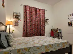 Spacious fully furnished master bedroom with attached bathroom and balcony