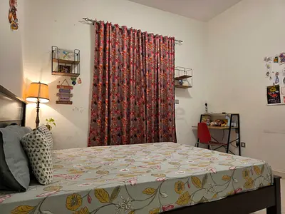 Spacious fully furnished master bedroom with attached bathroom and balcony