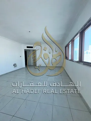 Spacious 2BHK for bachelors on Jamal Abdul Nasser St, Al Majaz 2 with free AC, maintenance, and contract attestation