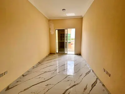 For annual rent in Al Muwaihat 3, Ajman, on the exit of Mohammed Bin Zayed Road - one bedroom and living room - master bedroom - central air condition