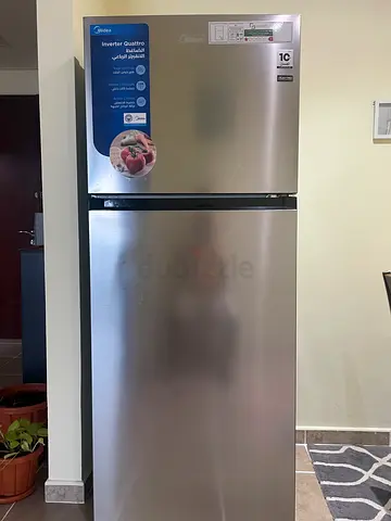 Silver double-door refrigerator - good condition under warranty