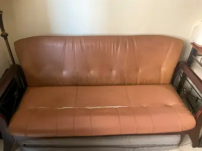 3-seater brown faux leather sofa with wooden arms — used