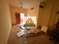 Al Nuaimiya Offer: Two-Bedroom Apartment with Central Air Conditioning and a Strategic Location